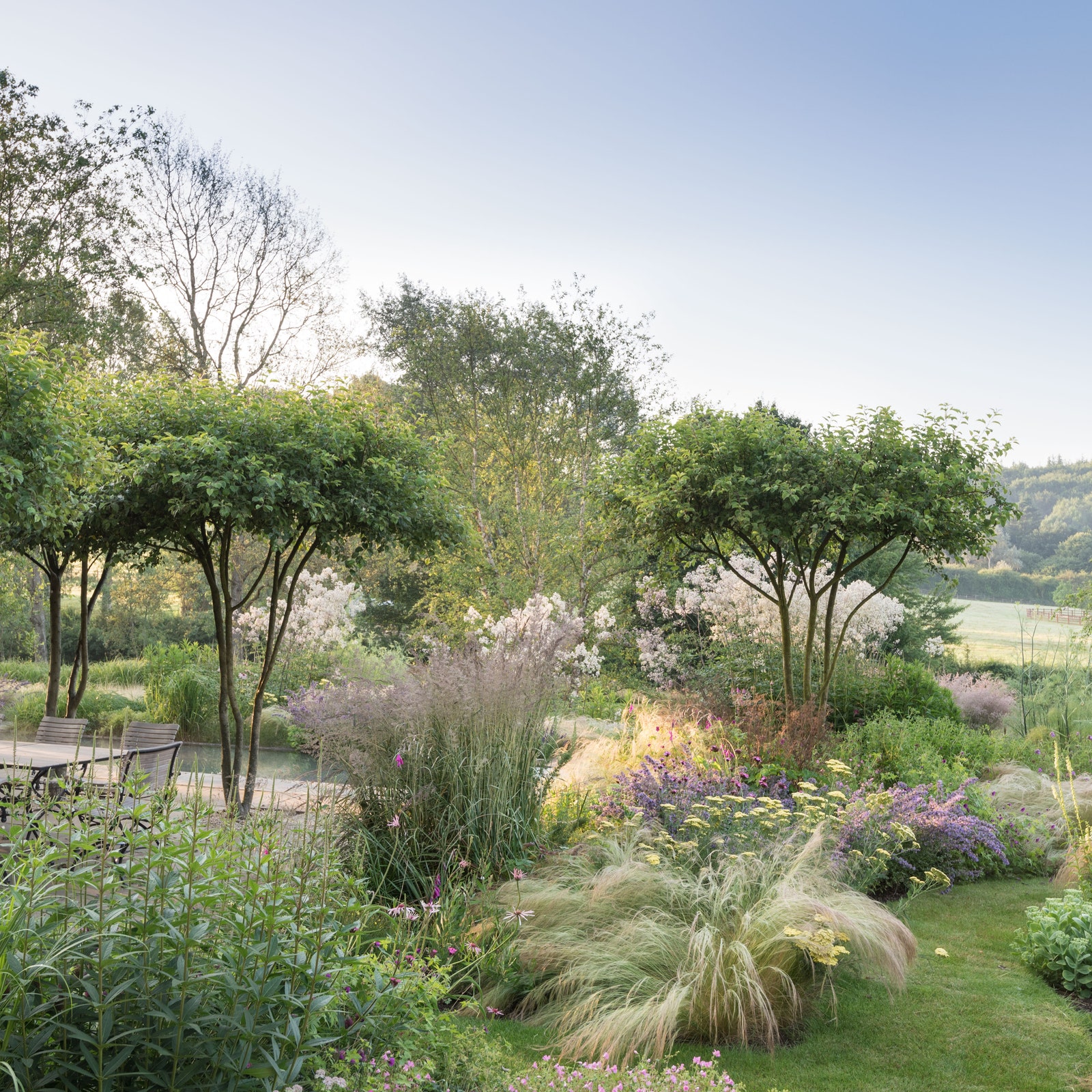 An English country garden with a gently rolling rhythm of planting